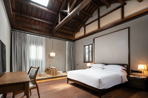 A minimalist guestroom at Marvel Land Boutique Hotel Huangshan Xiuli