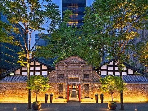 Restored Qing-dynasty gate at The Upper House, Chengdu, at dusk
