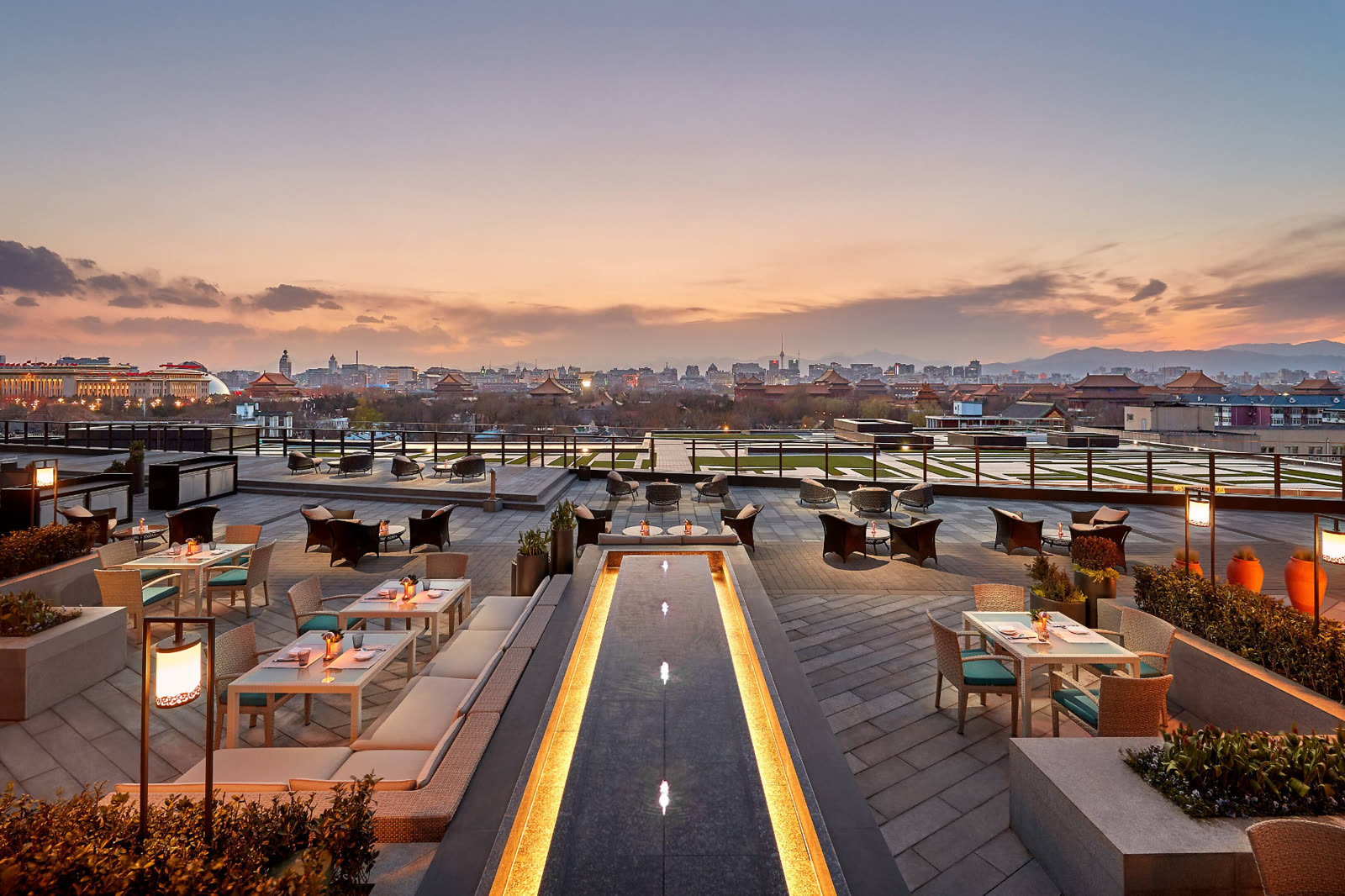 Rooftop terrace at dusk overlooking the Forbidden City, Mandarin Oriental Wangfujing, Beijing