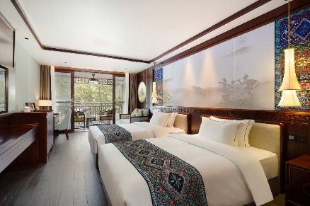 Guest room with balcony at Mount Fanjing Qixi Resort Hotel