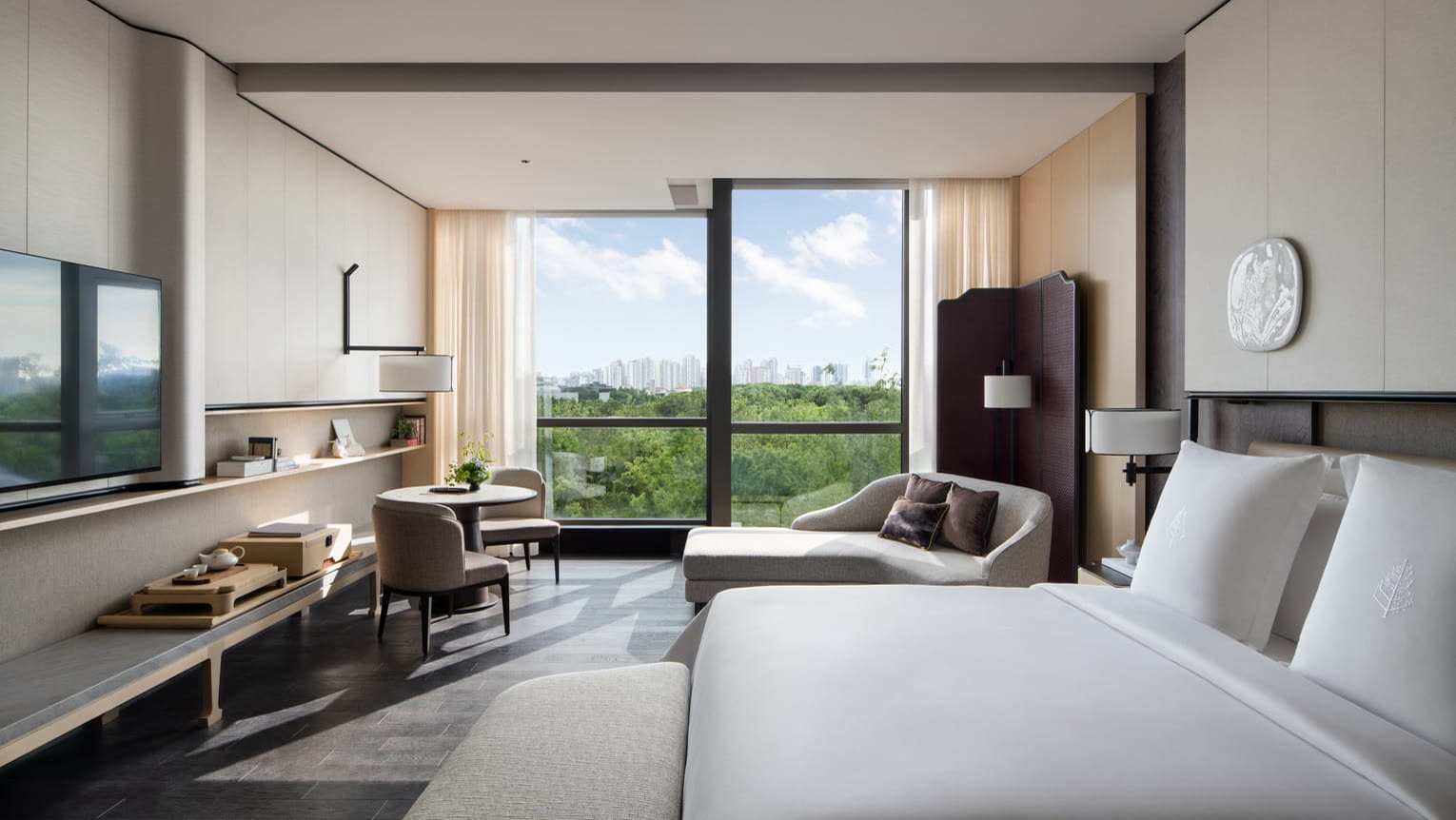 Guest room with treetop and lake views at Four Seasons Hotel Suzhou