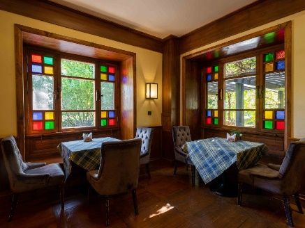 Stained-glass dining lounge at Songtsam Lodge Benzilan