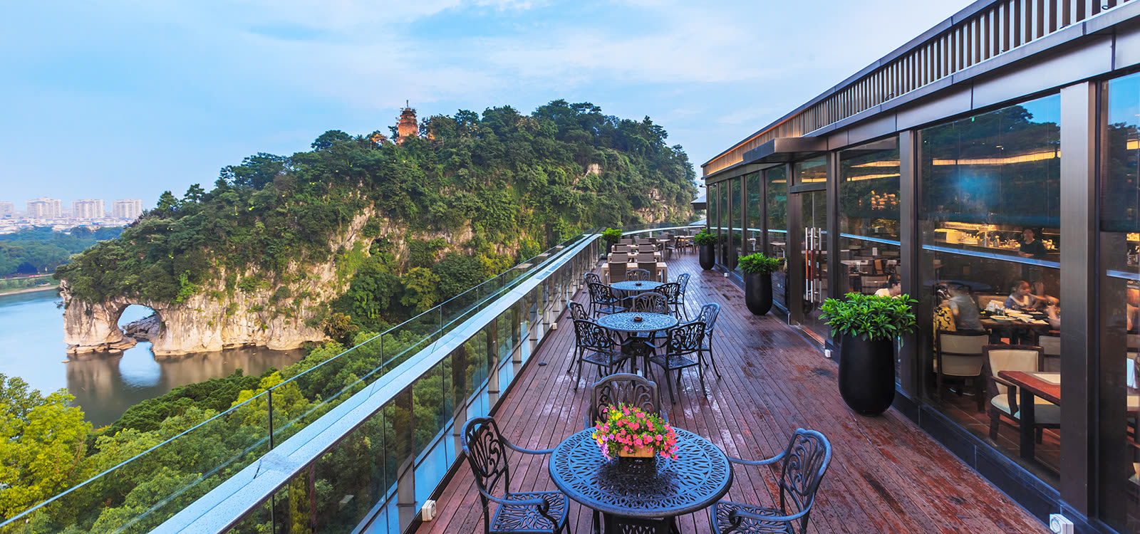 Rooftop restaurant terrace at Jolie Vue looking across the Li River to Elephant Trunk Hill