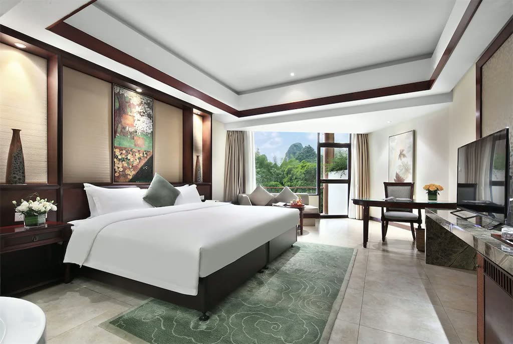 River View Double at Yangshuo Resort with a large window onto karst scenery