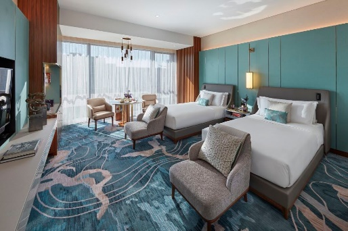 A teal-accented twin room at the Mandarin Oriental Wangfujing, Beijing