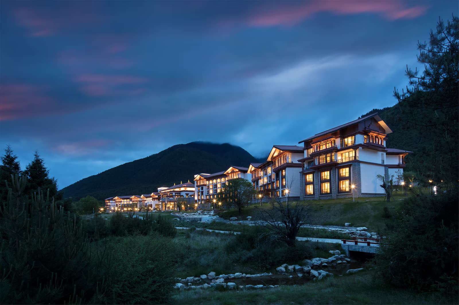 Hilton Nyingchi Resort with Himalayan mountains behind