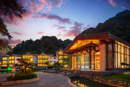 Mount Fanjing Qixi Resort Hotel lit at dusk