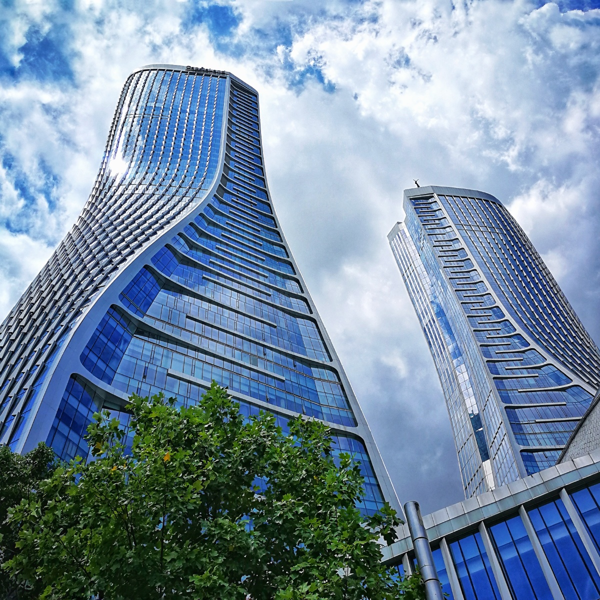 Modern glass towers rising above Hangzhou