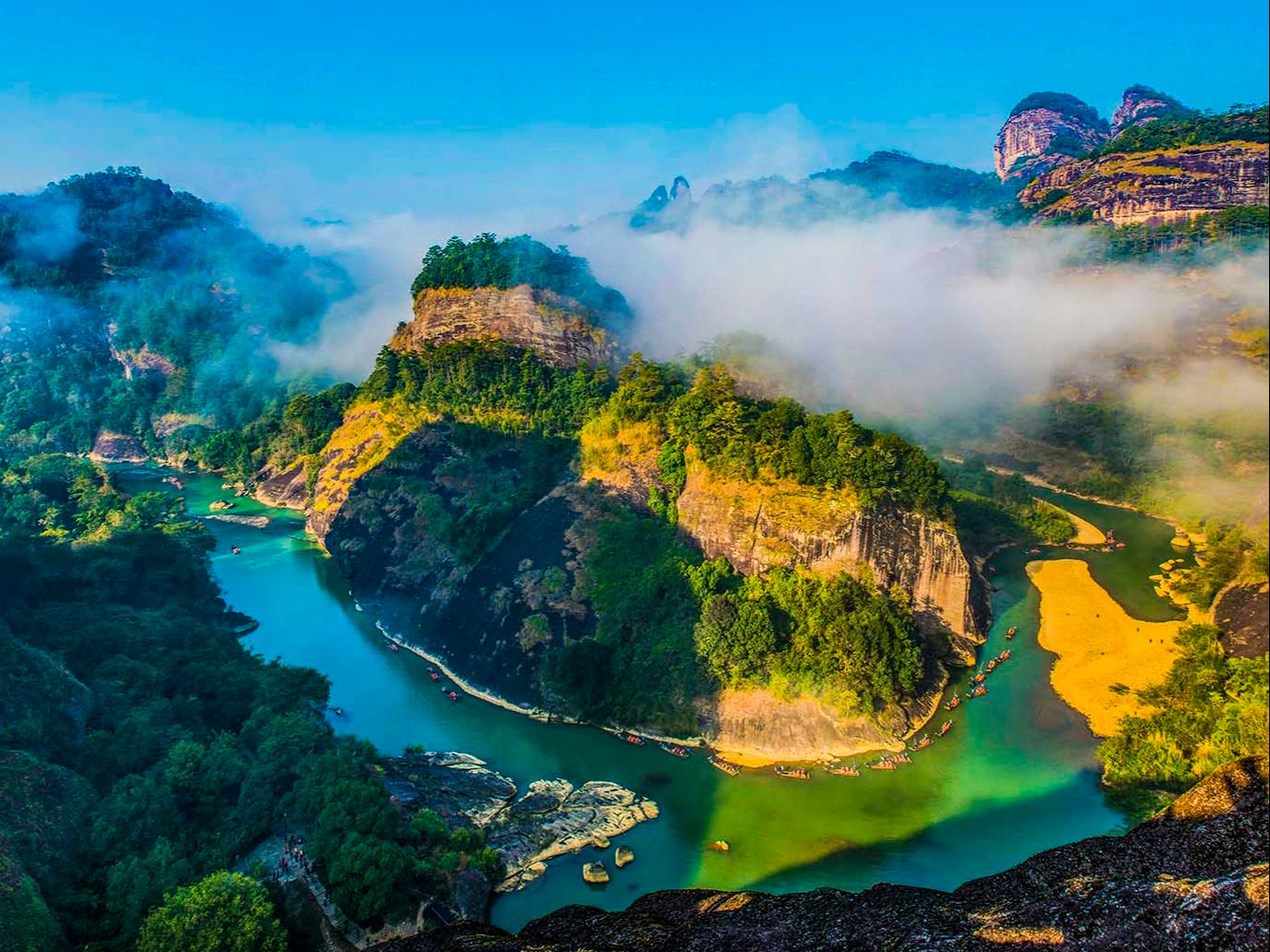 The Nine Bend Stream curling around mist-wrapped cliffs at Mount Wuyi