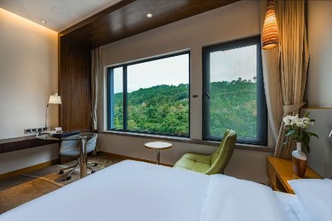 Guest room with garden view at Xiaoqikong Ruijing Hotel