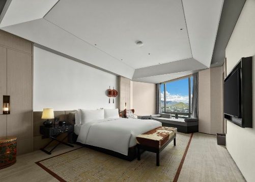 Guest room with mountain view at Hilton Shigatse