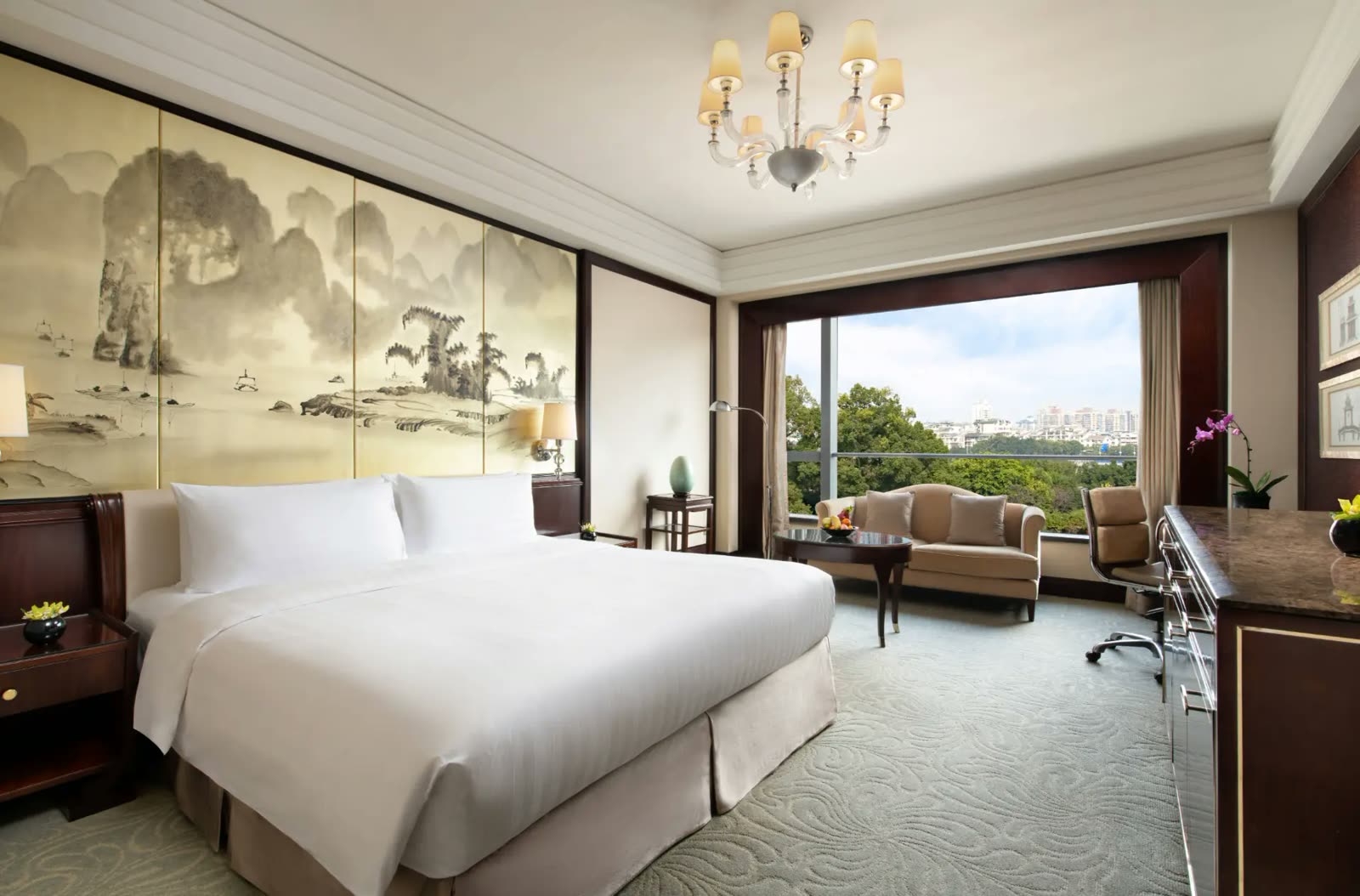Deluxe River View Room at Shangri-La Guilin with an ink landscape screen and city outlook
