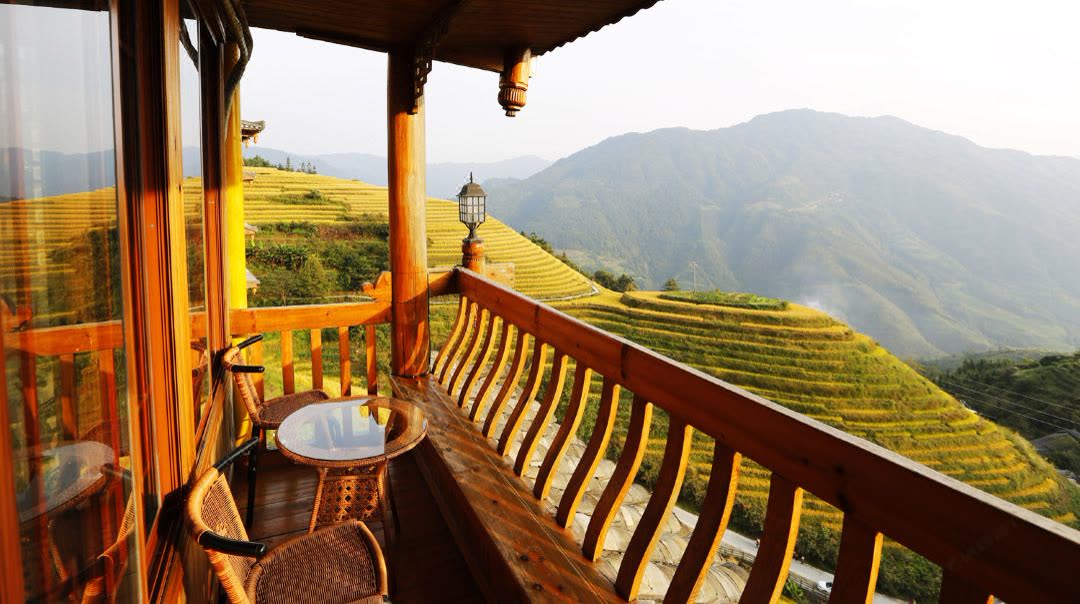 Balcony of a Terrace View Room at Longji One Art looking over the rice terraces