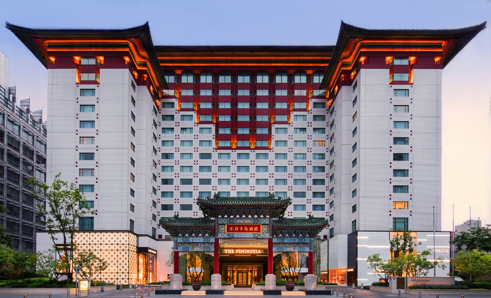 Facade of The Peninsula Beijing at dusk