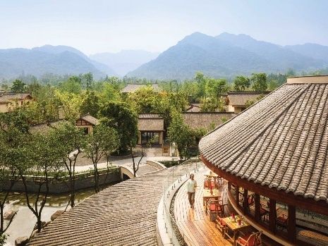 Aerial view of Six Senses Qingcheng Mountain among forested hills